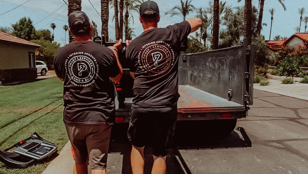 A collection of bulk trash items including workout equipment on a Phoenix neighborhood curb 